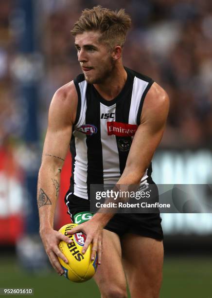 Sam Murray of the Magpies controls the ball during the AFL round six match between the Collingwood Magpies and Richmond Tigers at Melbourne Cricket...