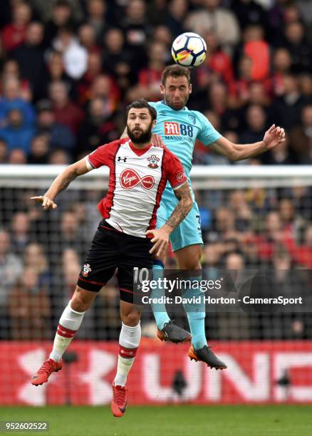 Southampton's Charlie Austin battles with Bournemouth's Steve Cook during the Premier League match between Southampton and AFC Bournemouth at St...