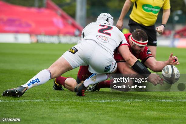 James Cronin of Munster fights for the ball with Rory Best of Ulster during the Guinness PRO14 match between Munster Rugby and Ulster Rugby at...