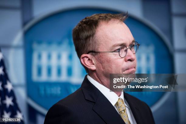 Director of the Office of Management and Budget Mick Mulvaney listens during a press briefing at the White House in Washington, DC on Saturday, Jan....