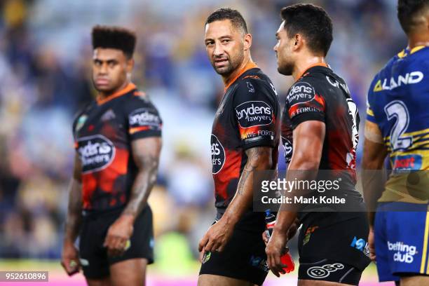Kevin Naiqama, Benji Marshall and Esan Marsters of the Tigers looks dejected after defeat during the round Eight NRL match between the Parramatta...