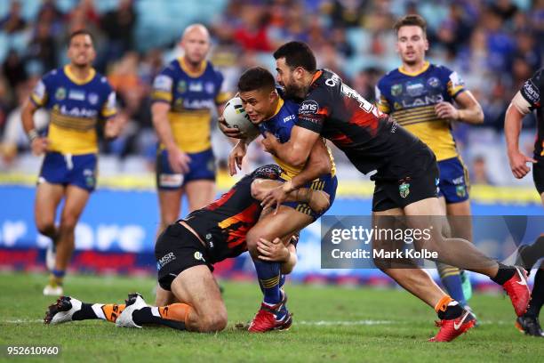 Kaysa Pritchard of the Eels is tackled during the round Eight NRL match between the Parramatta Eels and the Wests Tigers at ANZ Stadium on April 29,...