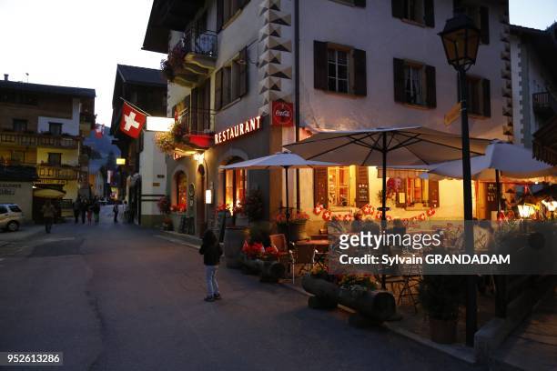 Switzerland, Valais, Val d'Herens, village of Evolene, the main street at night// Suisse, Valais, Val d'Herens, village d'Evolene, la rue principale...