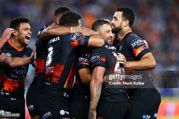 Benji Marshall of the Tigers celebrates with his team after scoring a try during the round Eight NRL match between the Parramatta Eels and the Wests...