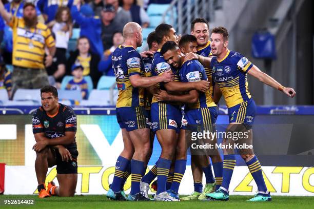 The Eels celebrates a try scored by Brad Takairangi of the Eels during the round Eight NRL match between the Parramatta Eels and the Wests Tigers at...