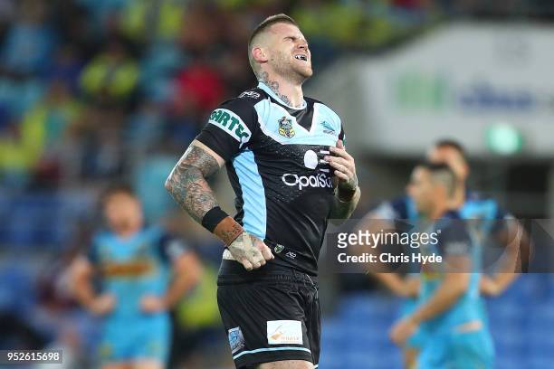 Josh Dugan of the Sharks leaves the field injured during the round eight NRL match between the Gold Coast Titans and Cronulla Sharks at Cbus Super...