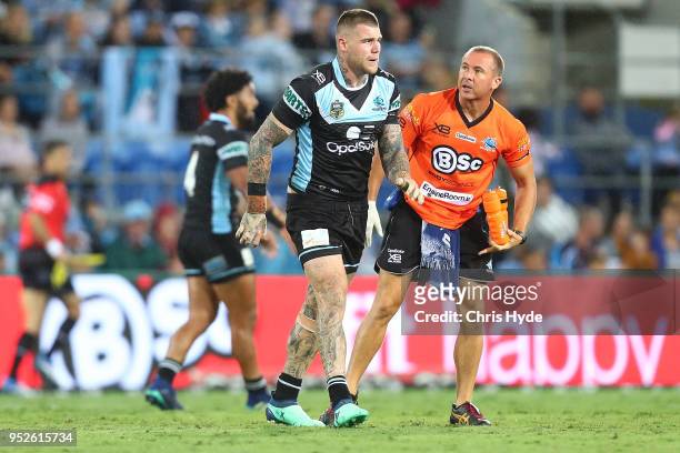 Josh Dugan of the Sharks leaves the field injured during the round eight NRL match between the Gold Coast Titans and Cronulla Sharks at Cbus Super...