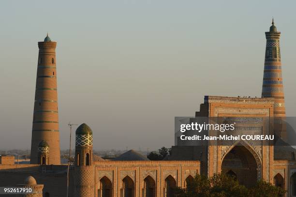 Medersa Mohammed Rakhim Khan and Minarets Islam Hoja and Juma, Khiva, Uzbekistan.