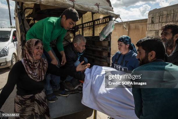 Woman grieves for her husband who died from a heart attack due to lack of medicine and aid in Ahras, where an estimated 50,000 displaced refugees are...