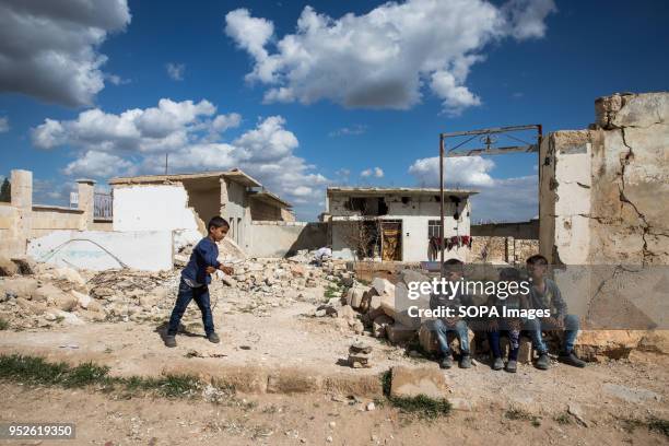 Children play in the rubble of an empty home they resettled after being displaced from the conflict in Afrin. An estimated 400,000 refugees fleeing...