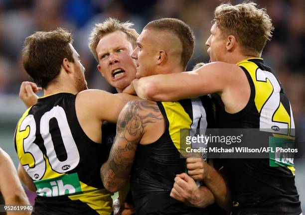 Jack Riewoldt of the Tigers celebrates a goal with teammates during the 2018 AFL round six match between the Collingwood Magpies and the Richmond...