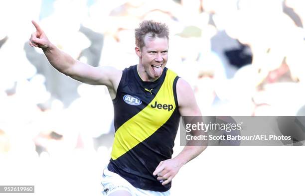 Jack Riewoldt of the Tigers celebrates after kicking a goal during the AFL round six match between the Collingwood Magpies and Richmond Tigers at...