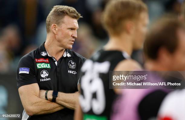 Nathan Buckley, Senior Coach of the Magpies addresses his players during the 2018 AFL round six match between the Collingwood Magpies and the...