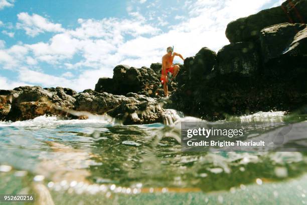 men in beautiful tropical hawaiian landscape, active lifestyle, snorkeling around princeville. - princeville stock pictures, royalty-free photos & images
