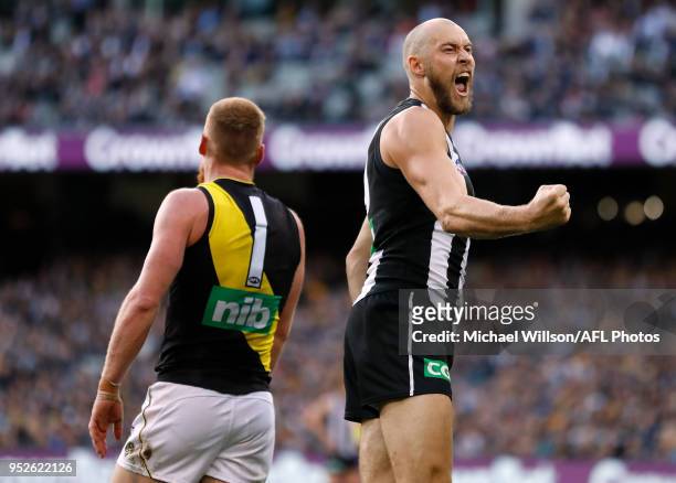 Ben Reid of the Magpies celebrates a goal during the 2018 AFL round six match between the Collingwood Magpies and the Richmond Tigers at the...