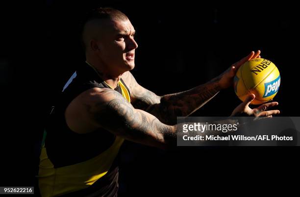 Dustin Martin of the Tigers warms up during the 2018 AFL round six match between the Collingwood Magpies and the Richmond Tigers at the Melbourne...