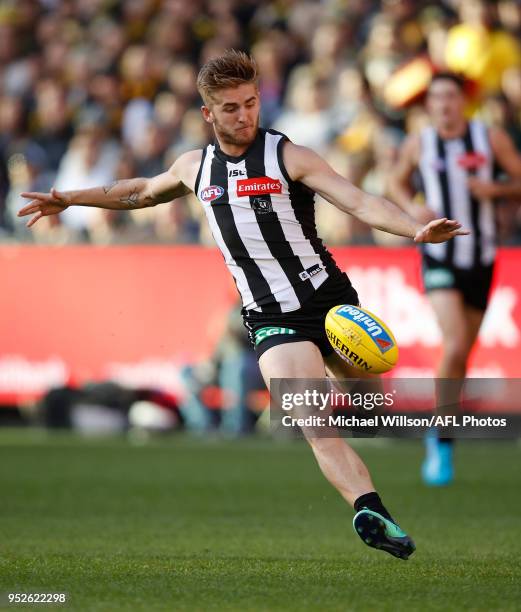 Sam Murray of the Magpies kicks the ball during the 2018 AFL round six match between the Collingwood Magpies and the Richmond Tigers at the Melbourne...