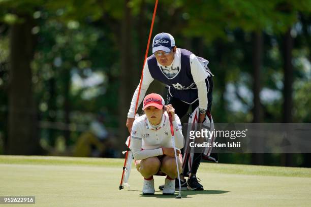 Erika Kikuchi of Japan prepares to putt on the 15th green during the final round of the CyberAgent Ladies Golf Tournament at Grand fields Country...