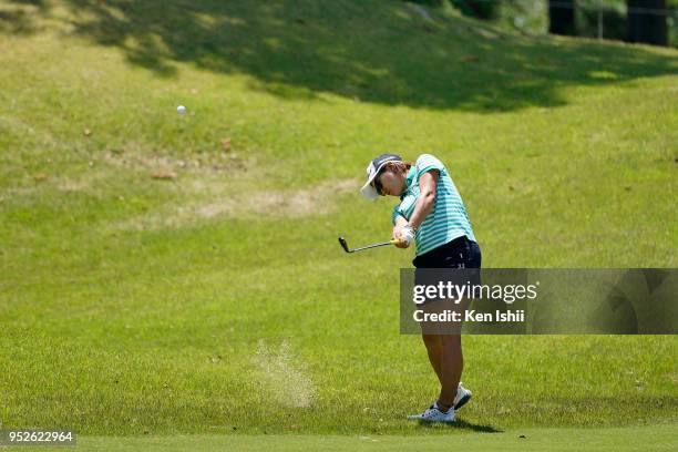 Misuzu Narita of Japan hits a second shot on the 15th green during the final round of the CyberAgent Ladies Golf Tournament at Grand fields Country...