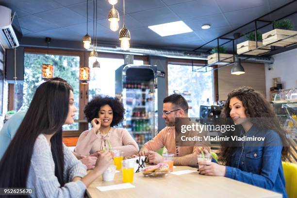 young people talking and eating ice cream and donuts - ice cream cake stock pictures, royalty-free photos & images