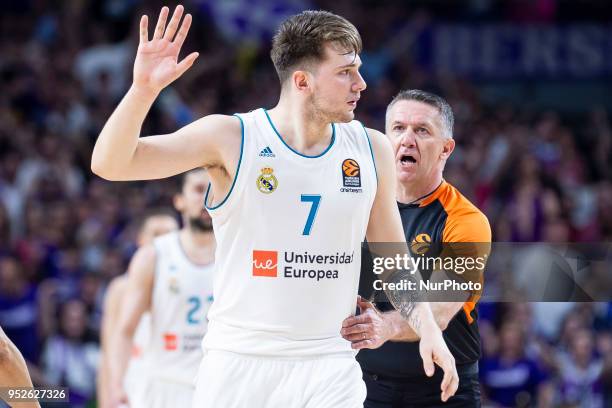 Luka Doncic of Real Madrid reacts with Sreten Radovic from Croatia during the Turkish Airlines Euroleague Play Offs Game 4 between Real Madrid v...