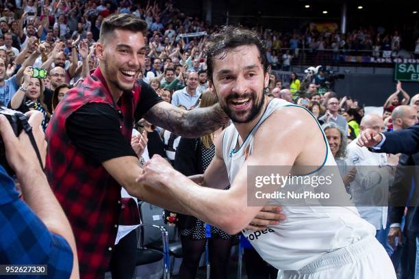 Willy Hernangomez and Sergio Llull of Real Madrid celebrate the victory during the Turkish Airlines Euroleague Play Offs Game 4 between Real Madrid v...