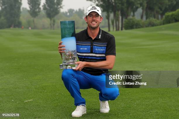 Alexander Bjork of Sweden holds the trophy as he celebrates winning the 2018 Volvo China Open at Topwin Golf and Country Club on April 29, 2018 in...