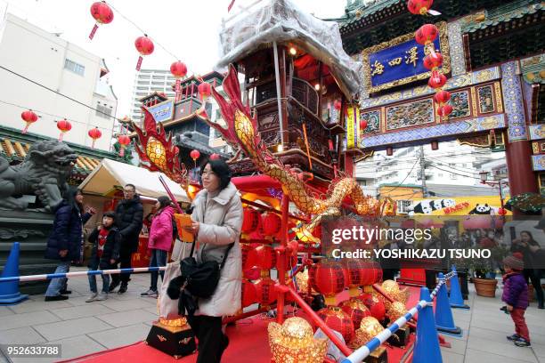 People visit a Chinese shrine at Yokohama Chinatown as Chinese Lunar New Year started in Yokohama, suburban Tokyo on January 29, 2017. People...