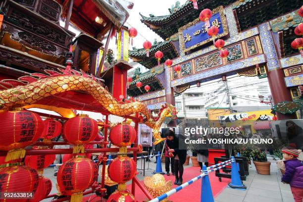 People visit a Chinese shrine at Yokohama Chinatown as Chinese Lunar New Year started in Yokohama, suburban Tokyo on January 29, 2017. People...