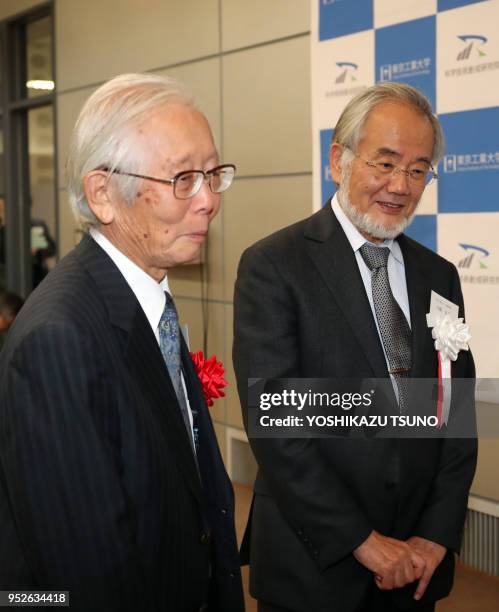 Tokyo Institute of Technology professor Yoshinori Ohsumi chats with 2000 Nobel laureate Hideki Shirakawa who graduated Tokyo Institute of Technology...