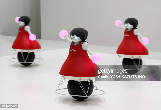Japan's electronic parts maker Murata Manufacturing displays a formation dancing robots "Murata Cheerleaders" at the CEATEC Japan 2016 in Chiba,...