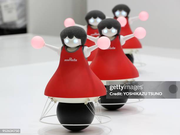 Japan's electronic parts maker Murata Manufacturing displays a formation dancing robots "Murata Cheerleaders" at the CEATEC Japan 2016 in Chiba,...