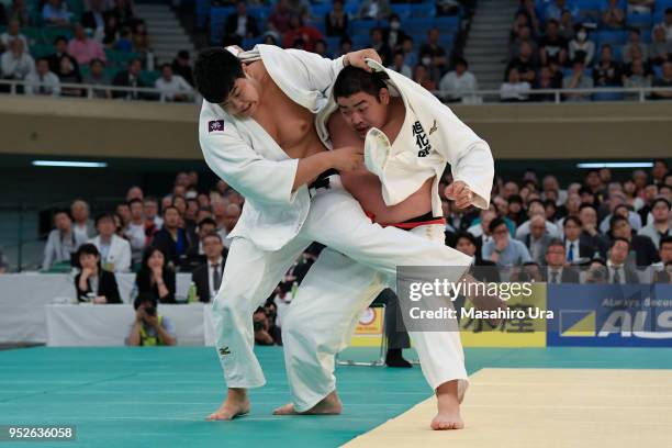 Yusei Ogawa attempts to throw Takeshi Ojitani in the semi final during the All Japan Judo Championship at the Nippon Budokan on April 29, 2018 in...