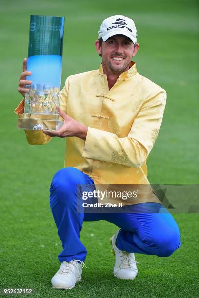 Alexander Bjork of Sweden holds the trophy as he celebrates winning the 2018 Volvo China Open at Topwin Golf and Country Club on April 29, 2018 in...