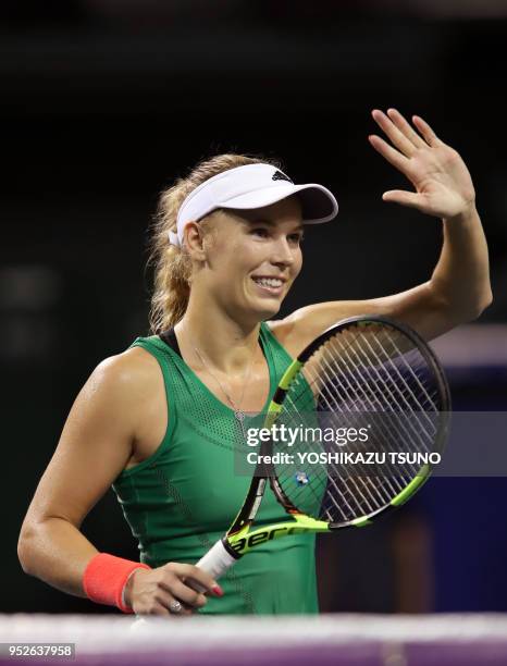 Caroline Wozniacki reacts to audience during the quarter finals of the Toray Pan Pacific Open tennis championships in Tokyo on September 23, 2016....