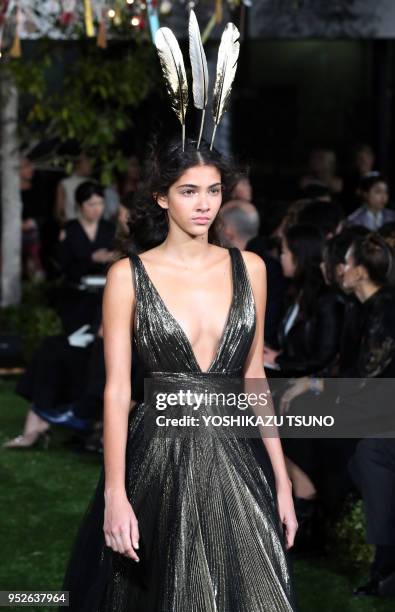 Model displays a creation designed by Italian designer Maria Grazia Chiuri during Dior's 2017 spring-summer haute couture collection at the rooftop...