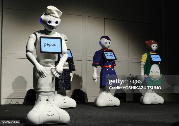 Softbank's humanoid robot Pepper display their outfits at Pepper's uniform design contest "Tokyo Pepper Collection" at the Pepper World exhibition in...