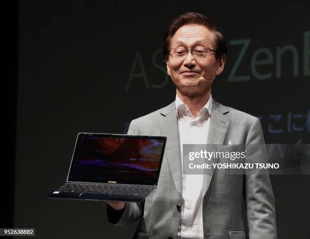 World's fourth largest computer maker ASUSTek Computer chairman Jonney Shih introduces the new notebook computer Zenbook 3 in Tokyo on September 28,...