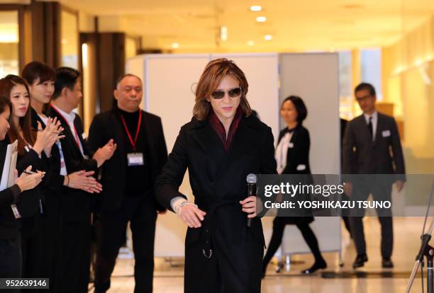 Yoshiki, a member of Japanese rock group "X Japan" arrives at an opening event to promote his designed kimono dress "Yoshikimono" at the Isetan...