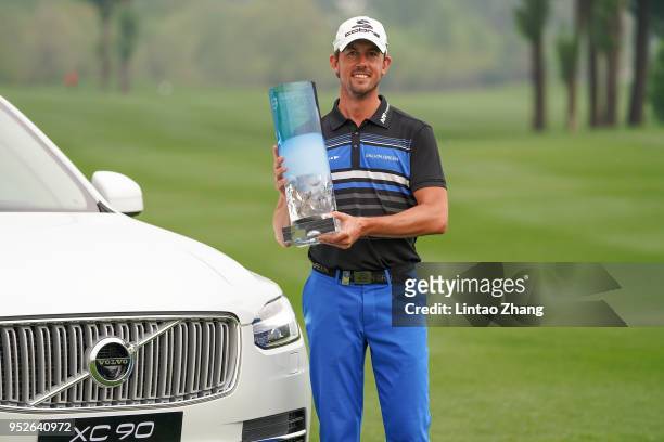 Alexander Bjork of Sweden holds the trophy celebrates after winning the 2018 Volvo China Open at Topwin Golf and Country Club on April 29, 2018 in...