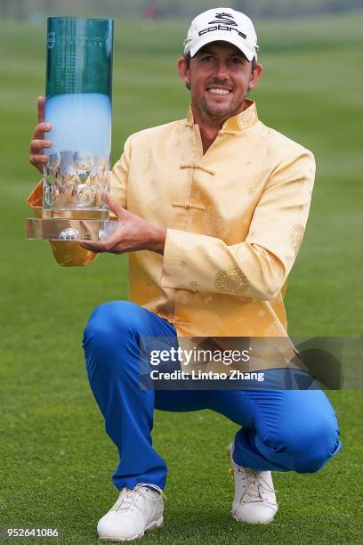 Alexander Bjork of Sweden holds the trophy celebrates after winning the 2018 Volvo China Open at Topwin Golf and Country Club on April 29, 2018 in...