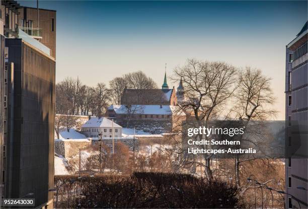 view to the akershus festning during mid-winter in oslo, norway. - ice fortress stock pictures, royalty-free photos & images