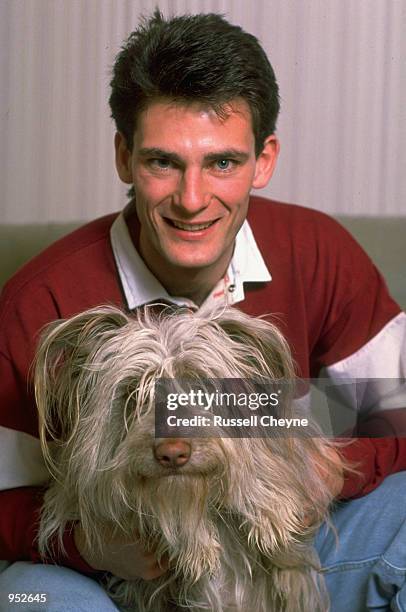 Craig Levein of Heart of Midlothian relaxes at home with his dog in Edinburgh, Scotland. \ Mandatory Credit: Russell Cheyne /Allsport