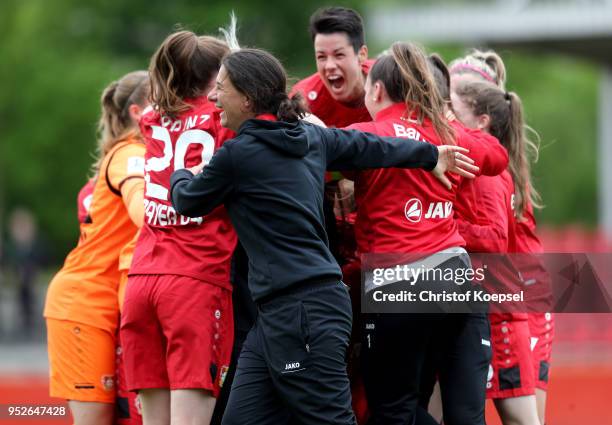 Head coach Verena Hagedorn and her team of Leverkusen celebrate the rising to the Bundesliga after winning 2-1 the Second Frauen-Bundesliga...