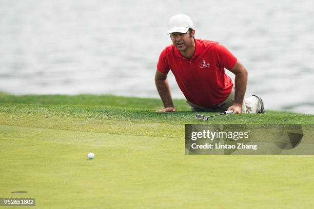 Jorge Campillo of Spain lines up a putt on the 9th hole during the final round of the 2018 Volvo China Open at Topwin Golf and Country Club on April...