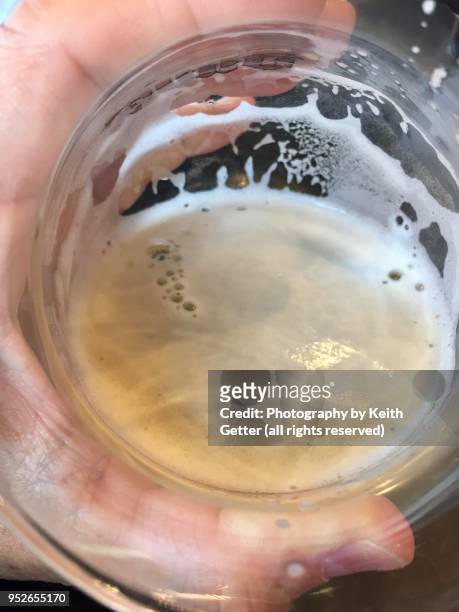holding a beer glass with a refreshing cold pale ale - pale ale stock pictures, royalty-free photos & images