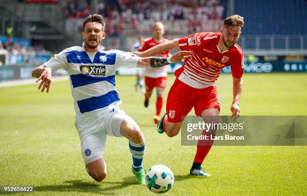 Boris Tashchy of Duisburg is challenged by Benedikt Gimber of Regensburg during the Second Bundesliga match between MSV Duisburg and SSV Jahn...