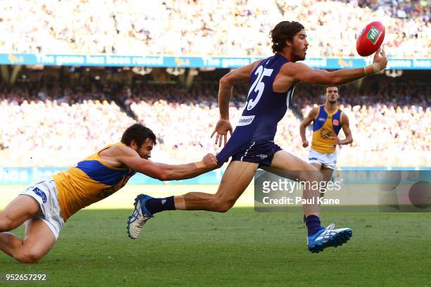 Alex Pearce of the Dockers gathers the ball against Josh Kennedy of the Eagles during the Round 6 AFL match between the Fremantle Dockers and West...