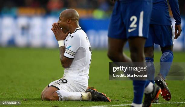 Swansea player Andre Ayew reacts after a chance goes begging during the Premier League match between Swansea City and Chelsea at Liberty Stadium on...