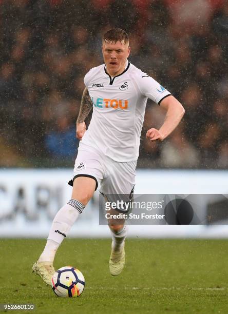 Swansea player Alfie Mawson in action during the Premier League match between Swansea City and Chelsea at Liberty Stadium on April 28, 2018 in...